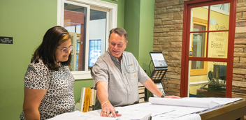 Team Talbert members reviewing plans in the Premium Window & Door office