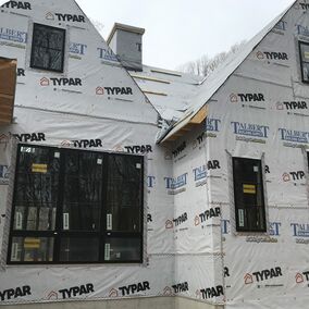 Home under construction with Marvin windows and Typar Talbert wrap