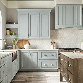 KraftMaid cabinets in light blue, with a wood island