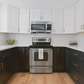 Blue Valley Cabinets, white wall cabinets paired with black counter cabinets