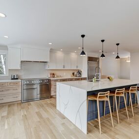 Large kitchen featuring a marble island, and NAC cabinets