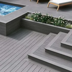 A photo showing a beautiful outdoor patio with composite voyage decking from Deckorators.