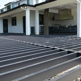 An image showing a big deck under construction using evolution steel framing for an alternative to standard treated wood deck foundation