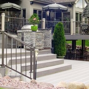 Outdoor deck featuring Digger Westbury Tuscany aluminum railing, offering a stylish and durable design