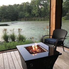 Freestanding porch with ScreenEze system, featuring a fire pit and lake view