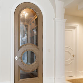 Half Round interior door featuring glass and gold trim